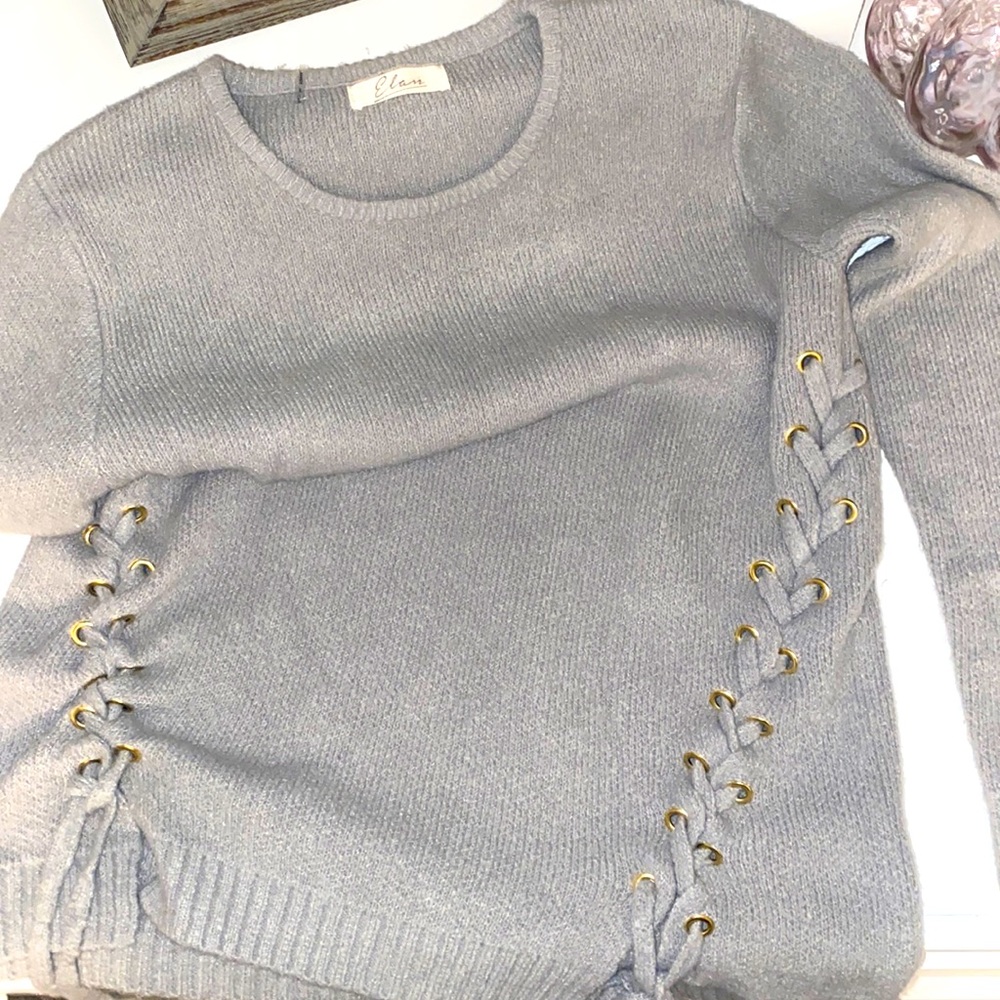 Grey sweater with ties . Great detail and condition
